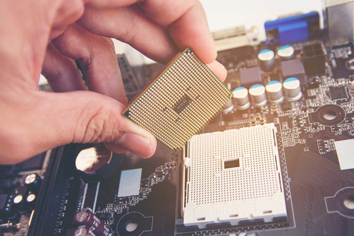 desktop processor being installed on a motherboard